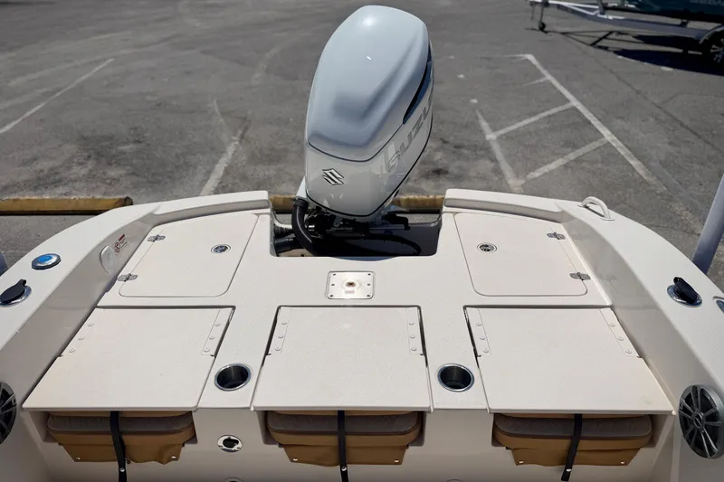Slide: The Image of 2026 Carolina Skiff 24 Ultra Elite boat with outboard motor and storage compartments. - 4