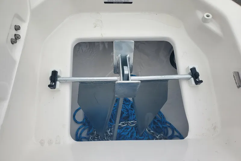 Slide: The Image of Anchor storage compartment on 2026 Chaparral 23 SSi boat with blue rope and chain. - 13