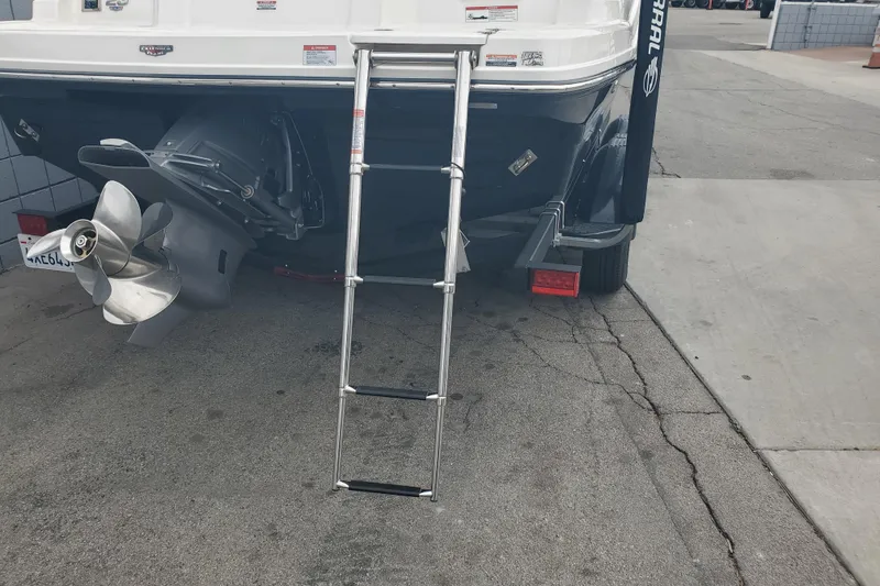Slide: The Image of Rear view of 2026 Chaparral 23 SSi boat with ladder and propeller. - 17