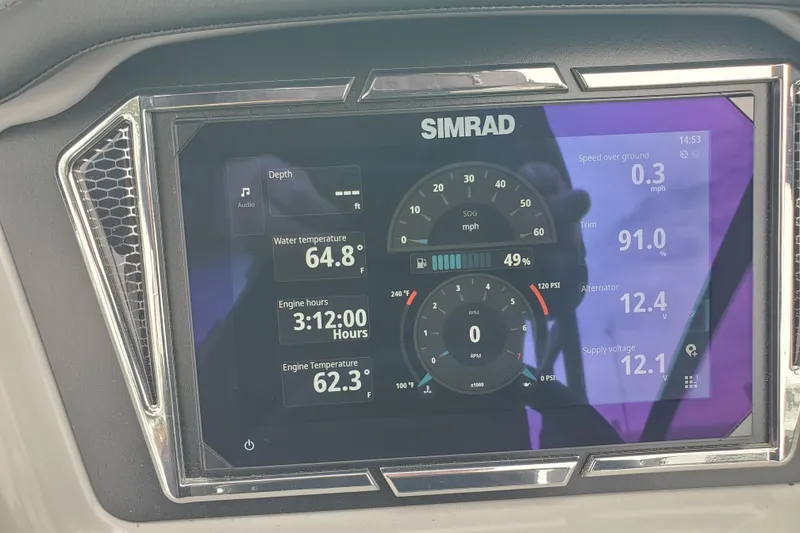 Slide: The Image of Simrad display on 2026 Chaparral 23 SSi showing engine metrics and water temperature. - 3