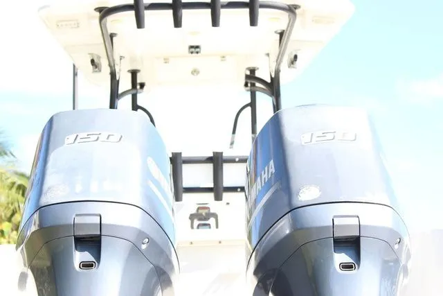 Slide: The Image of Two Yamaha 150 outboard motors on a 2015 Sailfish 240 CC boat. - 10
