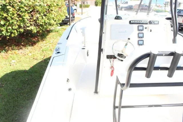Slide: The Image of Interior view of a 2015 Sailfish 240 CC boat with steering console. - 14