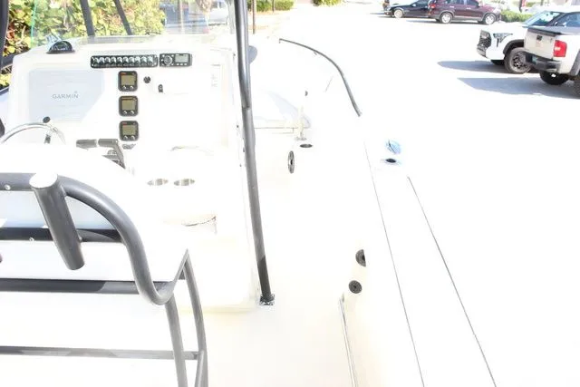 Slide: The Image of Interior view of a 2015 Sailfish 240 CC boat with helm console. - 15