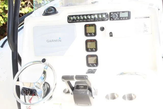 Slide: The Image of Dashboard of a 2015 Sailfish 240 CC with Garmin system. - 17