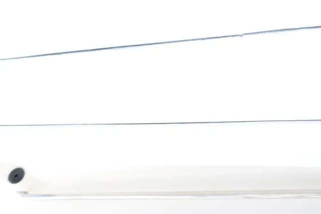 Slide: The Image of Close-up of a white 2015 Sailfish 240 CC boat hull. - 18
