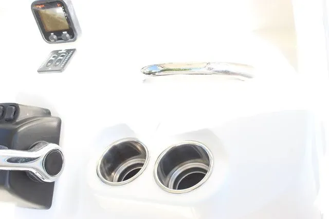 Slide: The Image of Dashboard of a 2015 Sailfish 240 CC boat with controls and gauges. - 19