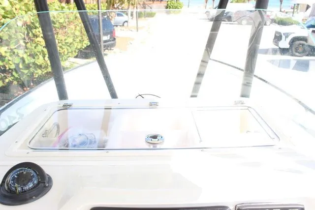 Slide: The Image of Sailfish 240 CC 2015 boat console with storage and controls. - 23