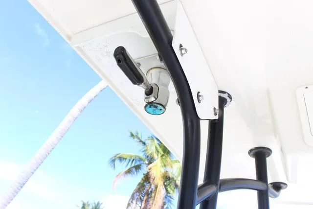 Slide: The Image of 2015 Sailfish 240 CC boat with palm trees in background. - 25