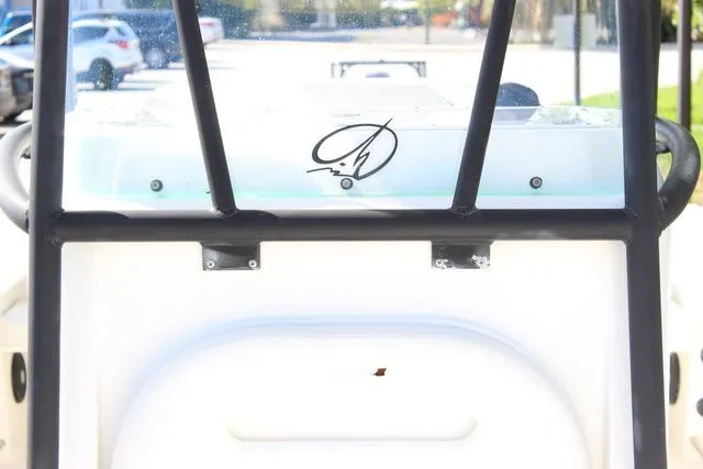 Slide: The Image of Close-up of the helm of a 2015 Sailfish 240 CC boat. - 26