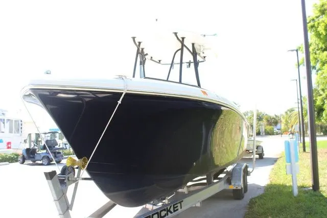 Slide: The Image of 2015 Sailfish 240 CC boat on trailer, side view. - 3