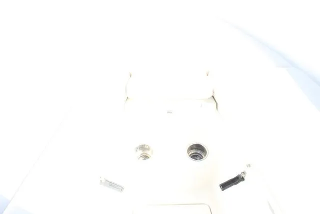 Slide: The Image of Overexposed image of a 2015 Sailfish 240 CC boat deck. - 30