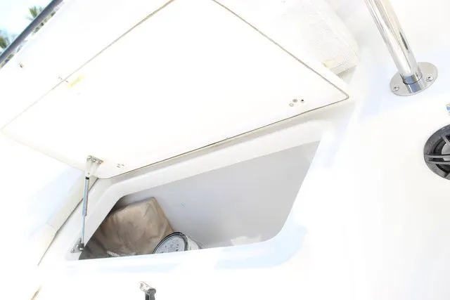 Slide: The Image of Open storage compartment on a 2015 Sailfish 240 CC boat. - 35
