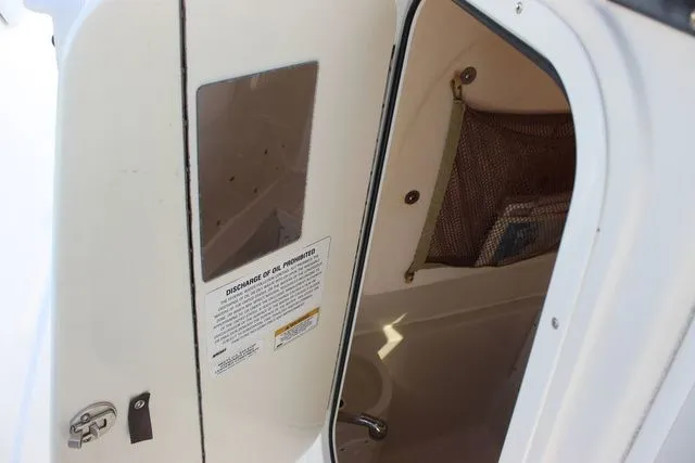 Slide: The Image of Interior of 2015 Sailfish 240 CC with storage compartment. - 37