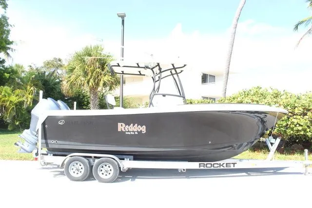 Slide: The Image of Black 2015 Sailfish 240 CC boat on trailer. - 4