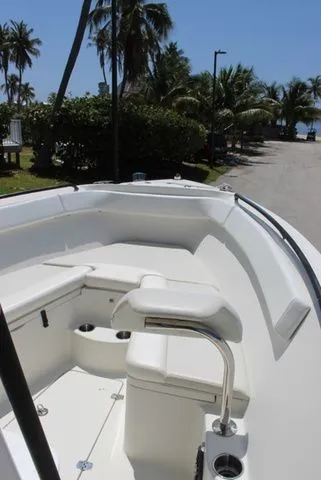 Slide: The Image of Sailfish 240 CC 2015 boat with seating area and palm trees in background. - 44