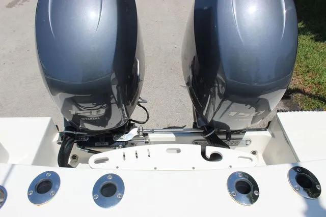 Slide: The Image of Two outboard motors on a 2015 Sailfish 240 CC boat. - 48