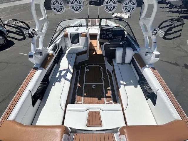 Slide: The Image of Interior view of a 2017 Nautique G25 boat with luxurious seating. - 10