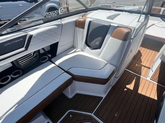 Slide: The Image of Interior of a 2017 Nautique G25 boat with luxurious seating. - 12
