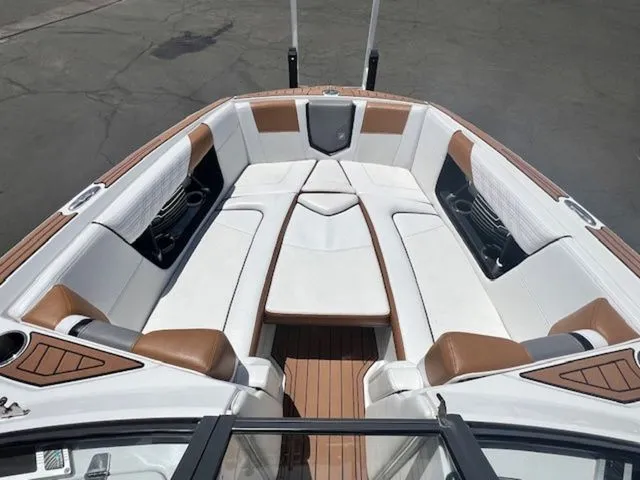 Slide: The Image of Interior of a 2017 Nautique G25 boat with luxurious seating. - 16