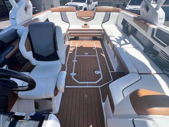 Slide: The Image of Interior of a 2017 Nautique G25 boat with luxurious seating. - 17