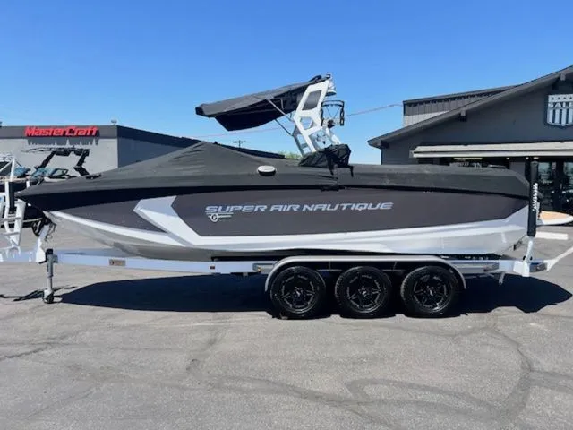 Slide: The Image of 2017 Nautique G25 boat on trailer, side view. - 21