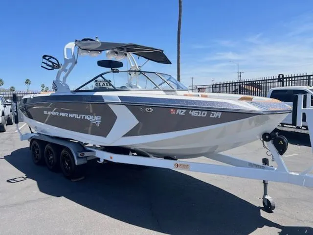 Slide: The Image of 2017 Nautique G25 boat on trailer in sunny weather. - 4
