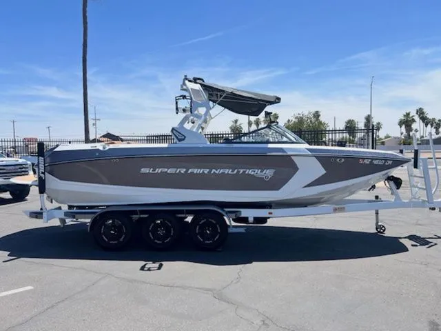Slide: The Image of 2017 Nautique G25 boat on trailer, side view. - 5