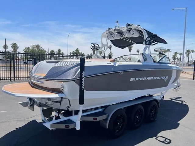 Slide: The Image of 2017 Nautique G25 boat on trailer, ready for adventure. - 6