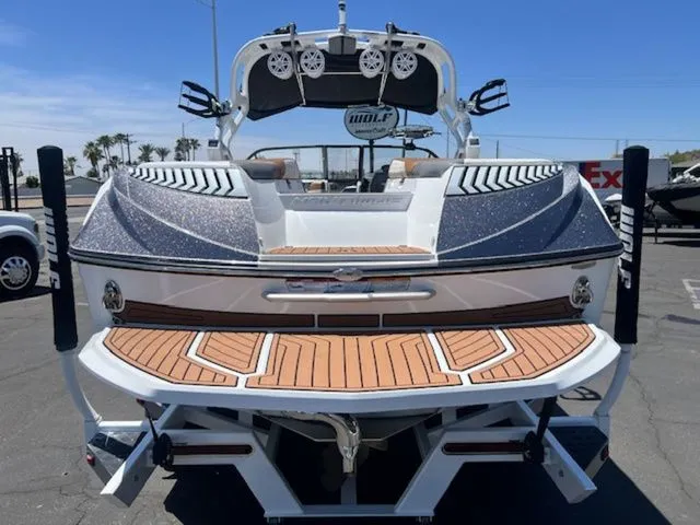 Slide: The Image of Rear view of a 2017 Nautique G25 boat in a parking lot. - 7