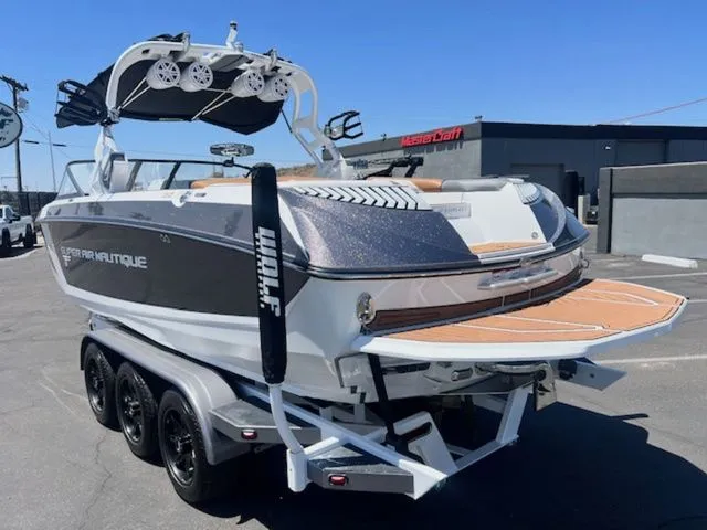 Slide: The Image of 2017 Nautique G25 boat on trailer, side view. - 8