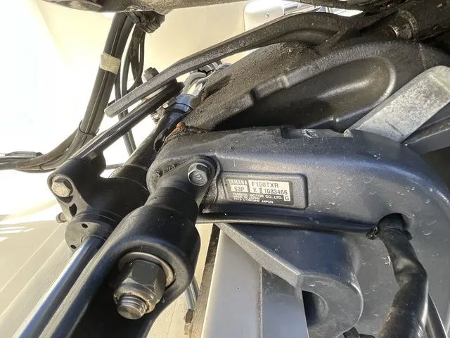 Slide: The Image of Close-up of a Yamaha engine part on a 2013 Stingray 208 LR boat. - 12