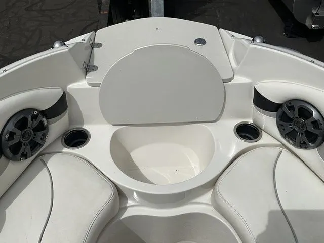 Slide: The Image of Interior of a 2013 Stingray 208 LR boat with speakers. - 16