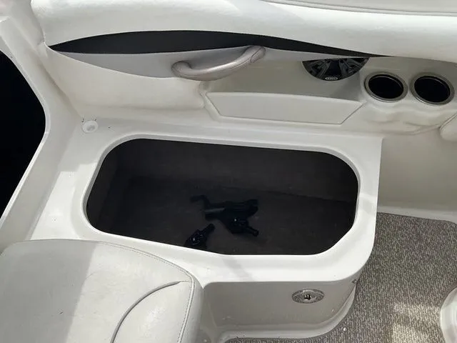 Slide: The Image of Interior of a 2013 Stingray 208 LR boat with storage compartment. - 25