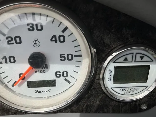 Slide: The Image of Tachometer and display of a 2013 Stingray 208 LR boat. - 29