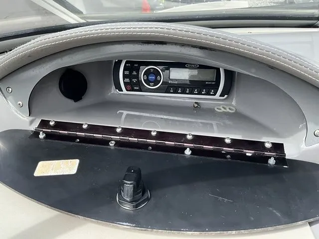 Slide: The Image of Dashboard of a 2013 Stingray 208 LR with audio system. - 33