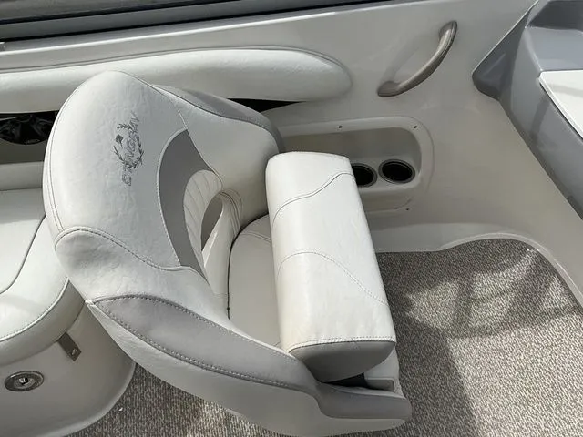 Slide: The Image of Interior of a 2013 Stingray 208 LR boat with gray seating. - 34
