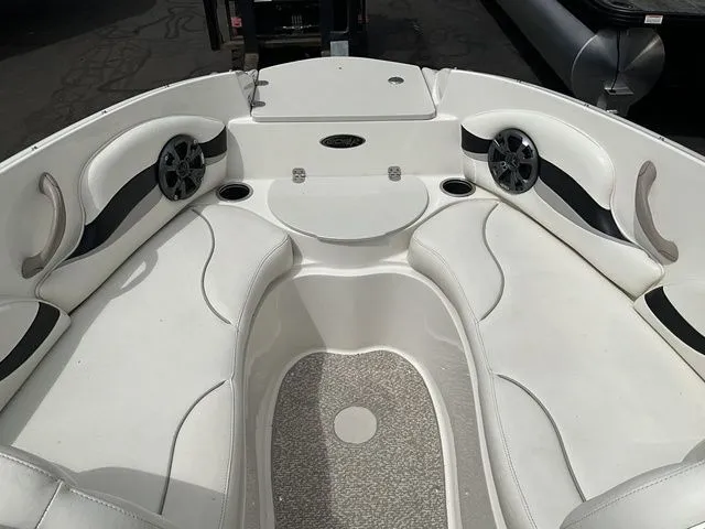 Slide: The Image of Interior of a 2013 Stingray 208 LR boat with white seating. - 7