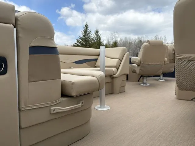 Slide: The Image of Interior of a 2018 Bennington 21 SLX pontoon boat with beige seating. - 10