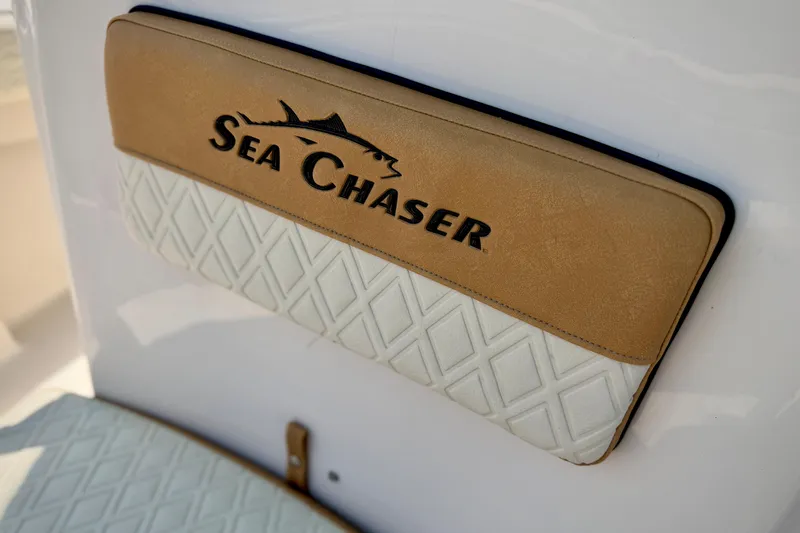 Slide: The Image of Sea Chaser 22 HFC 2026 boat seat with logo and diamond pattern design. - 21