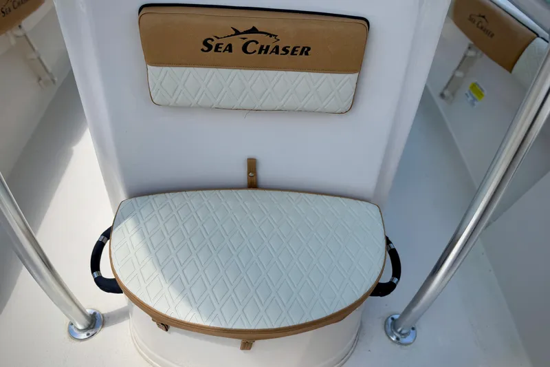 Slide: The Image of 2026 Sea Chaser 22 HFC boat seat with diamond-patterned upholstery and logo. - 23