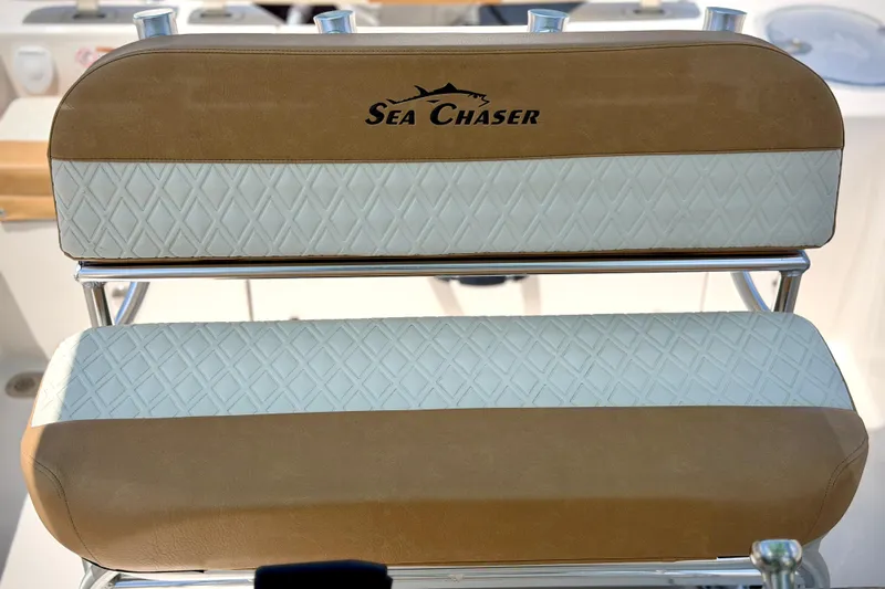 Slide: The Image of 2026 Sea Chaser 22 HFC boat seat with tan and white diamond pattern upholstery. - 27