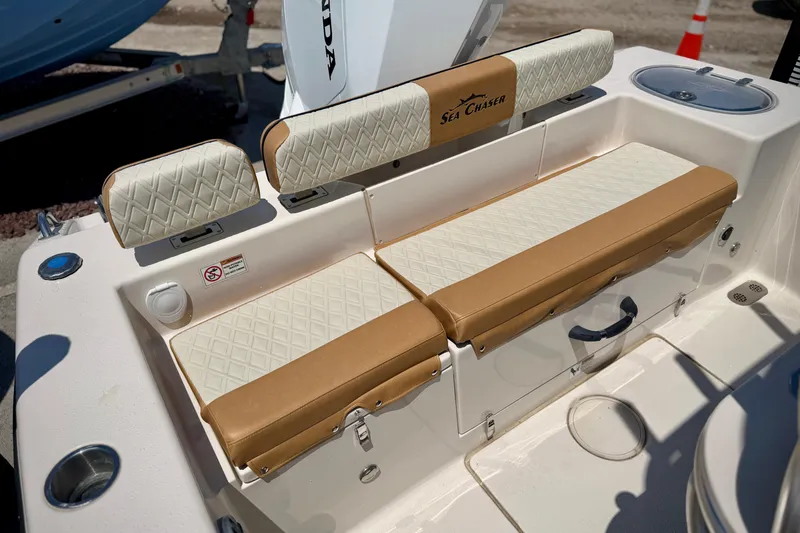 Slide: The Image of 2026 Sea Chaser 22 HFC boat seating with tan and white upholstery. - 35