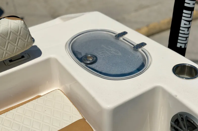 Slide: The Image of 2026 Sea Chaser 22 HFC boat interior with cushioned seating and storage compartment. - 37