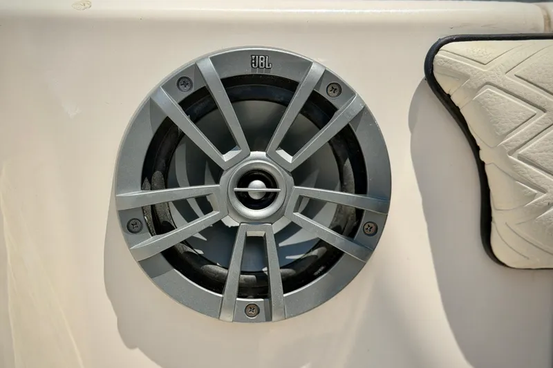 Slide: The Image of JBL speaker on 2026 Sea Chaser 22 HFC boat, featuring sleek design and cushioned seating. - 38