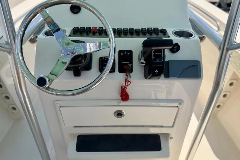 Slide: The Image of Steering console of 2026 Sea Chaser 22 HFC boat with controls and gauges. - 42