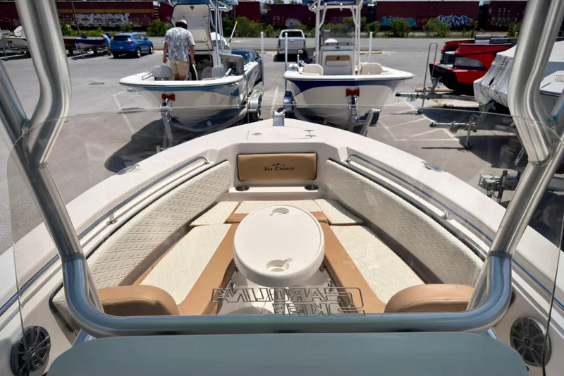 Slide: The Image of 2026 Sea Chaser 22 HFC boat interior with seating and helm view. - 53