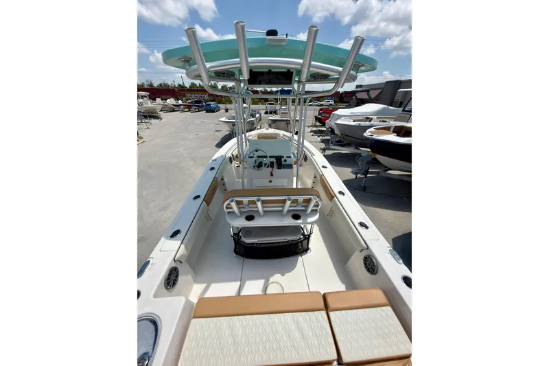 Slide: The Image of 2026 Sea Chaser 22 HFC boat interior with seating and steering console. - 55