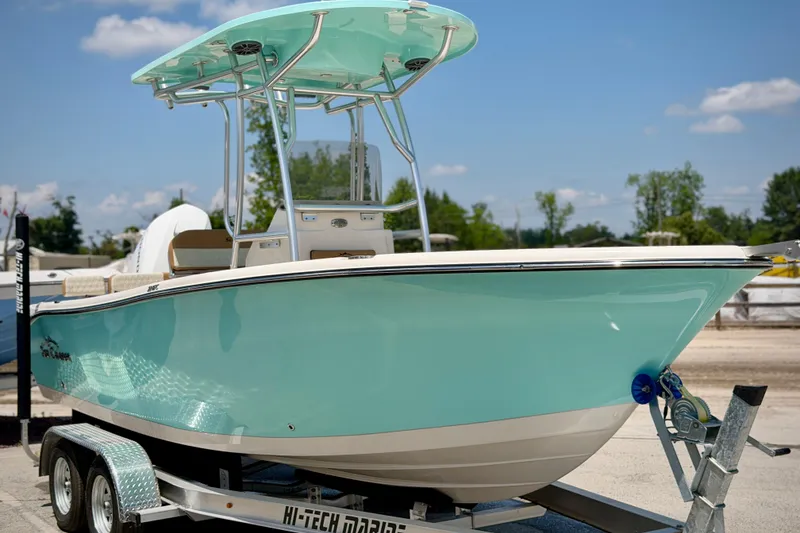 Slide: The Image of 2026 Sea Chaser 22 HFC boat on trailer, light blue hull, sunny day. - 62