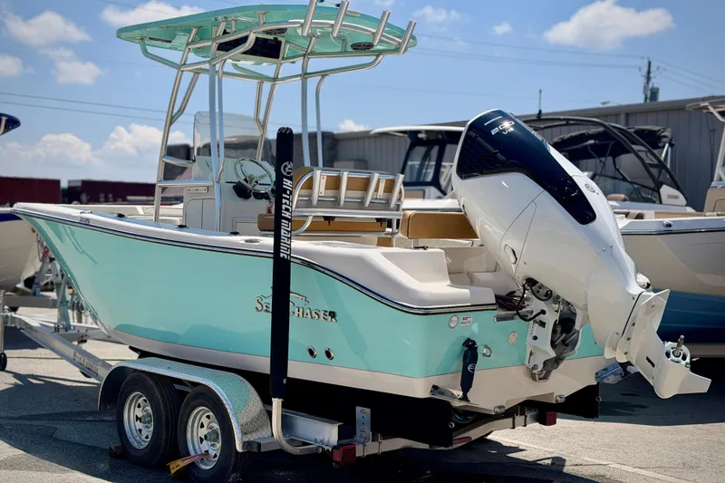 Slide: The Image of 2026 Sea Chaser 22 HFC boat on trailer, featuring sleek design and powerful outboard motor. - 7