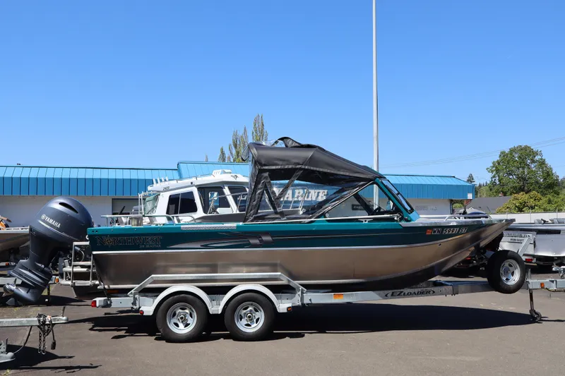 The Image of 2019 Northwest 208 SeaStar boat on trailer with Yamaha engine, parked outdoors. - 1